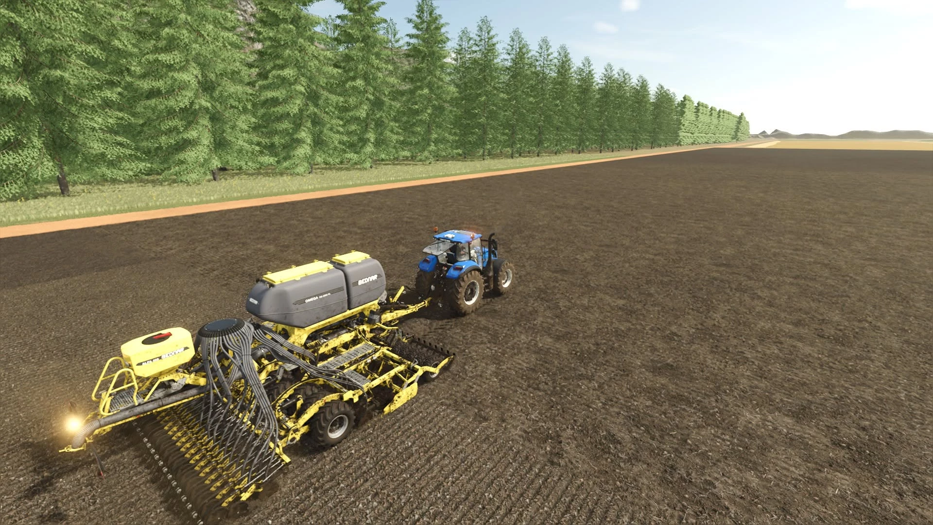 Semis des blés. New-holland T5 XTR.
